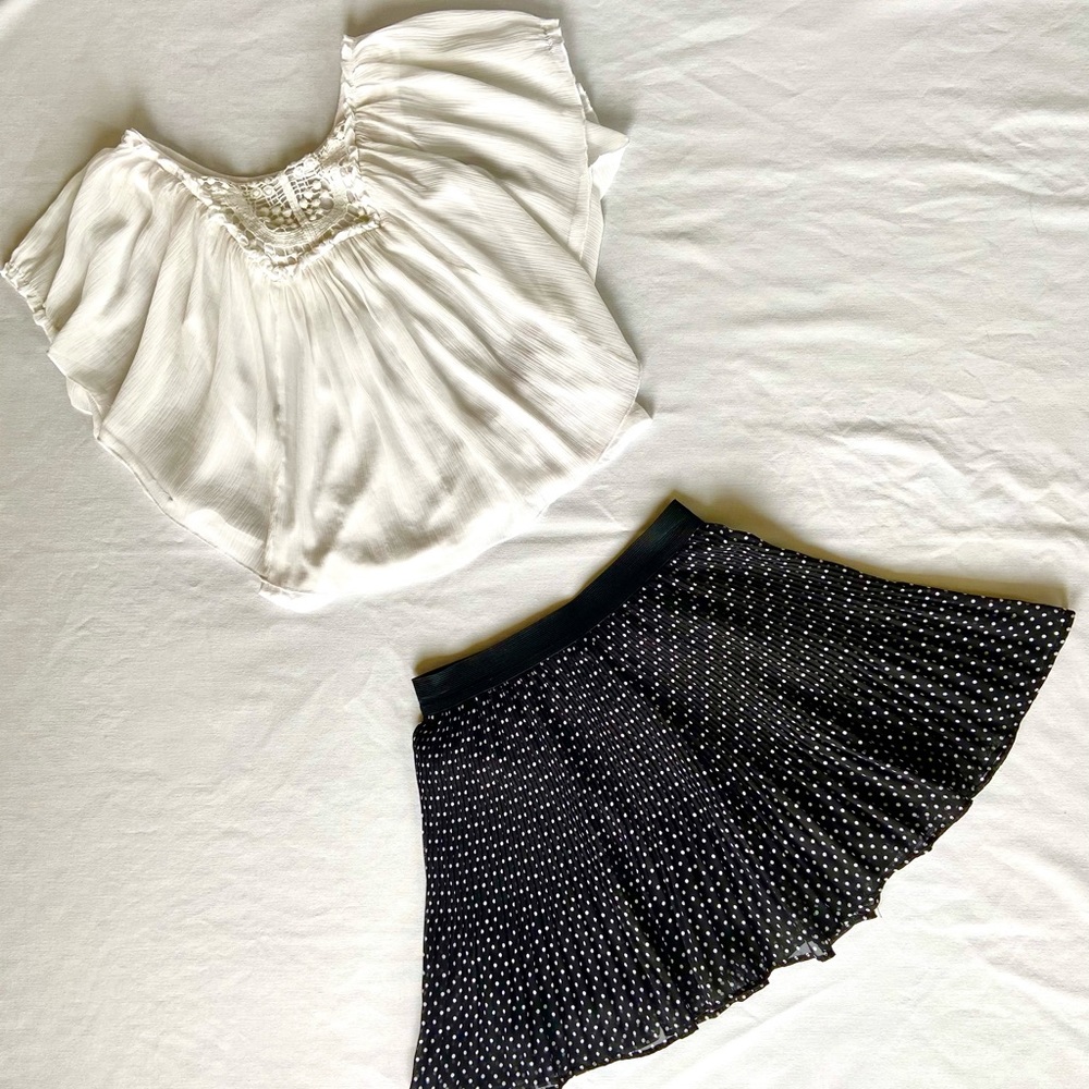 White blouse and black polka dotted skirt